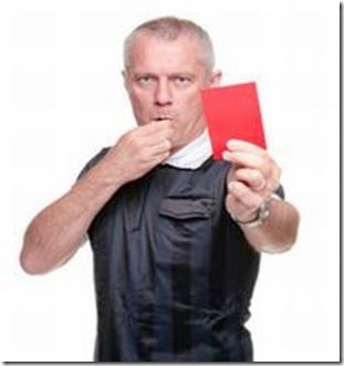 Football referee showing the red card